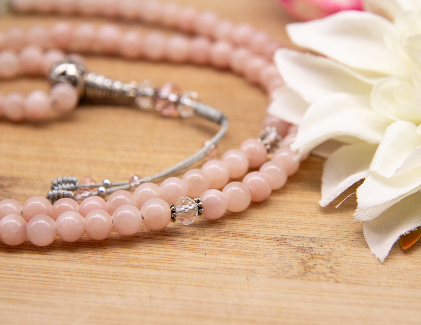 Mala aus rosa Angelit und facettiertem Glas – 6 mm