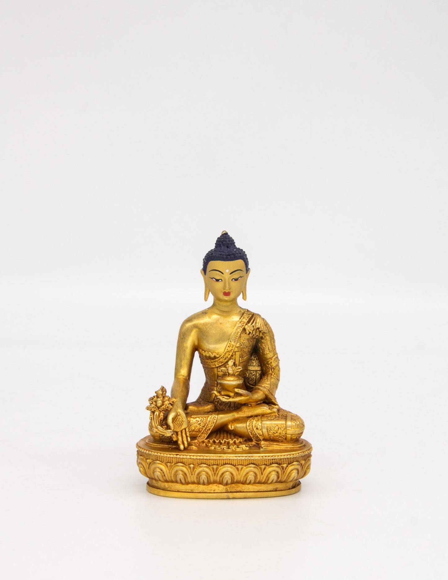 Kleine goldene Gottheitsstatuen