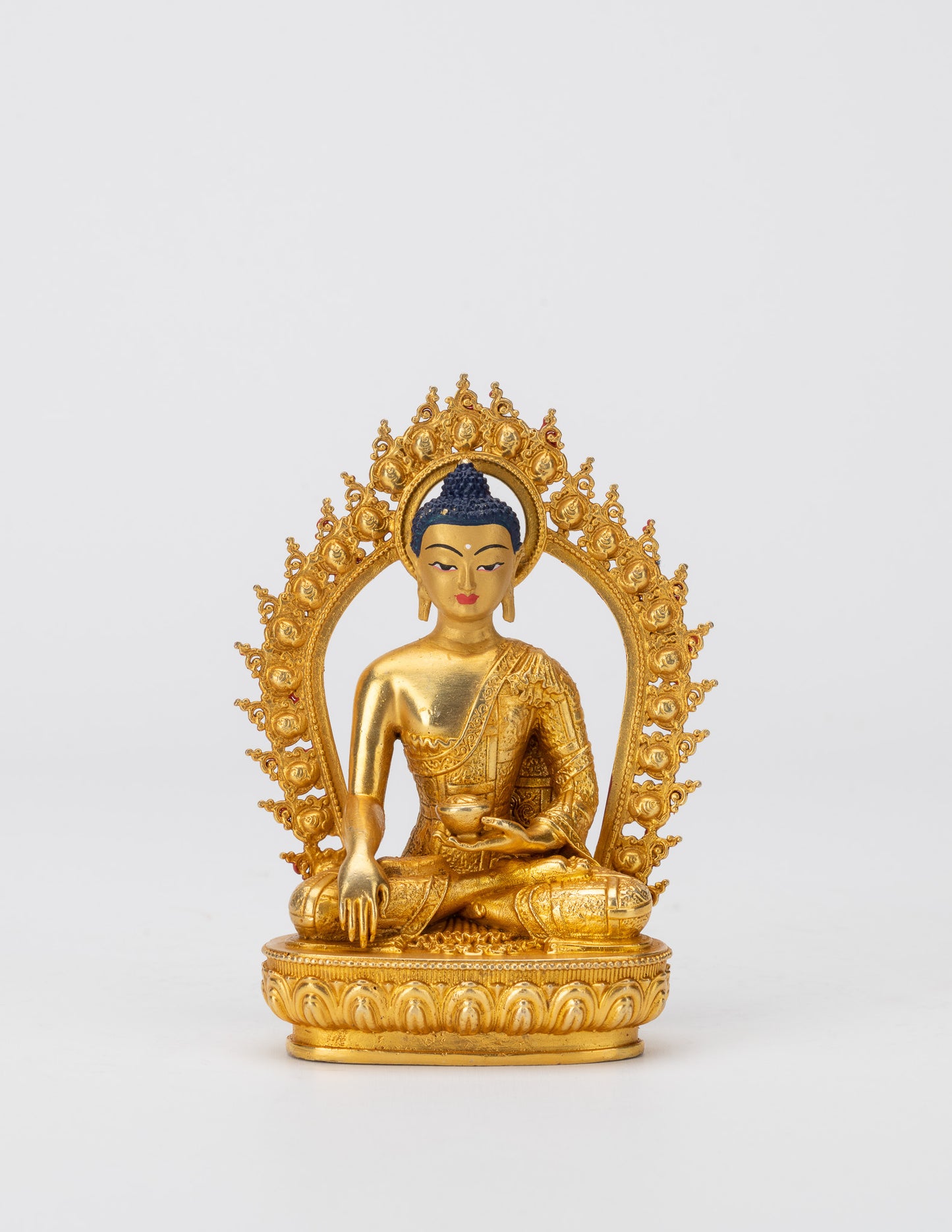 Kleine goldene Gottheitsstatuen