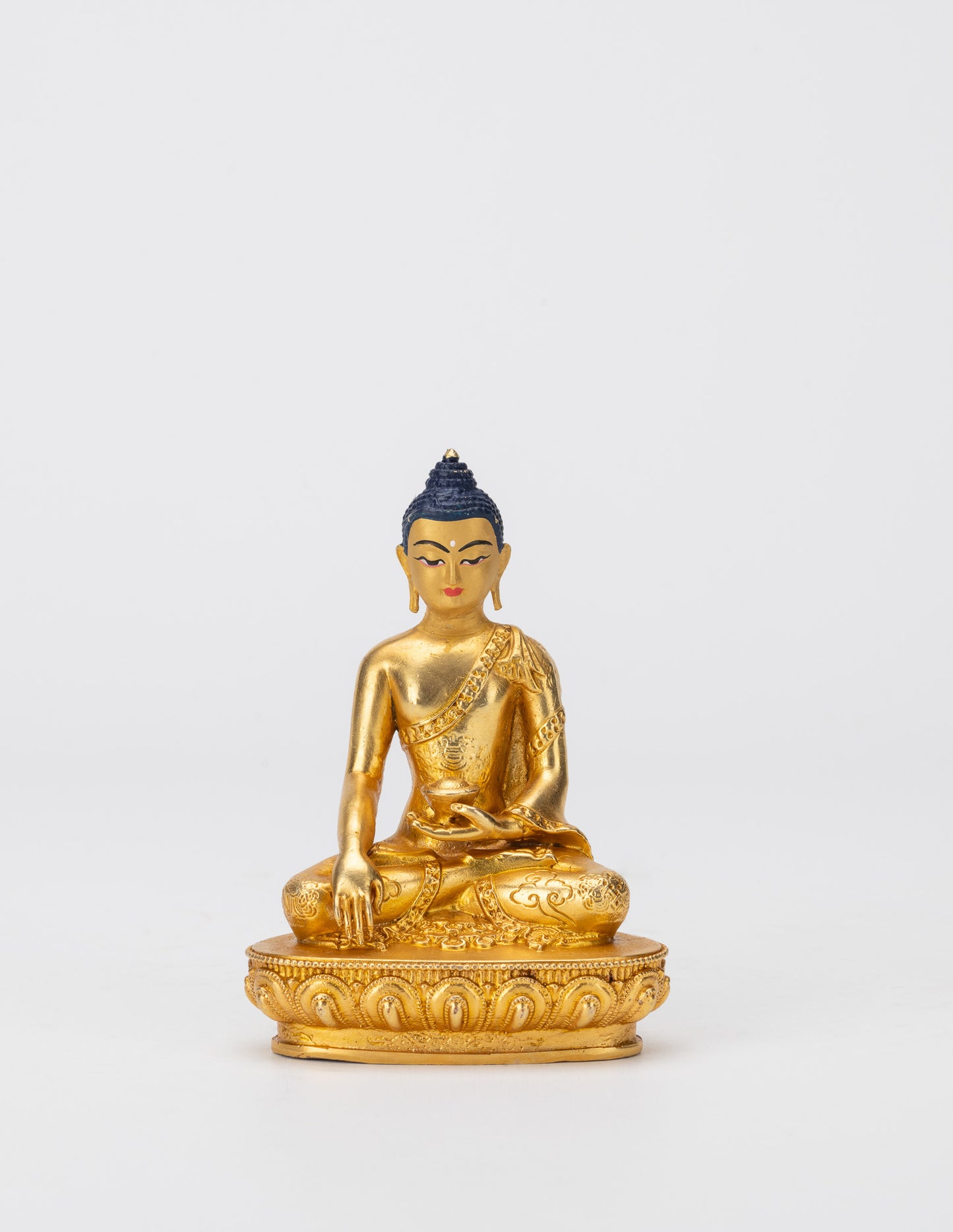 Kleine goldene Gottheitsstatuen